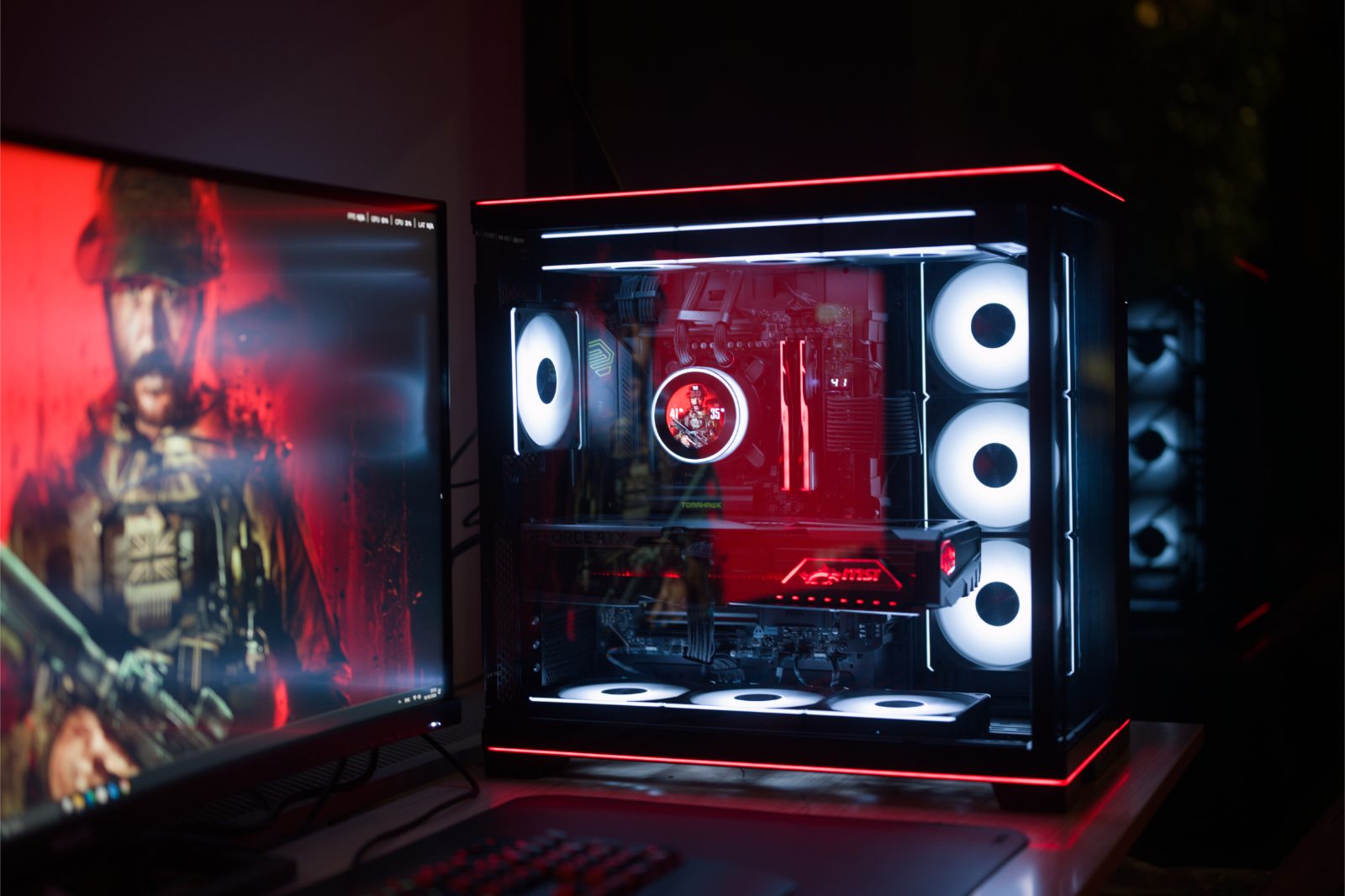 Open side view of the build with white lit fans and the LCD pump head